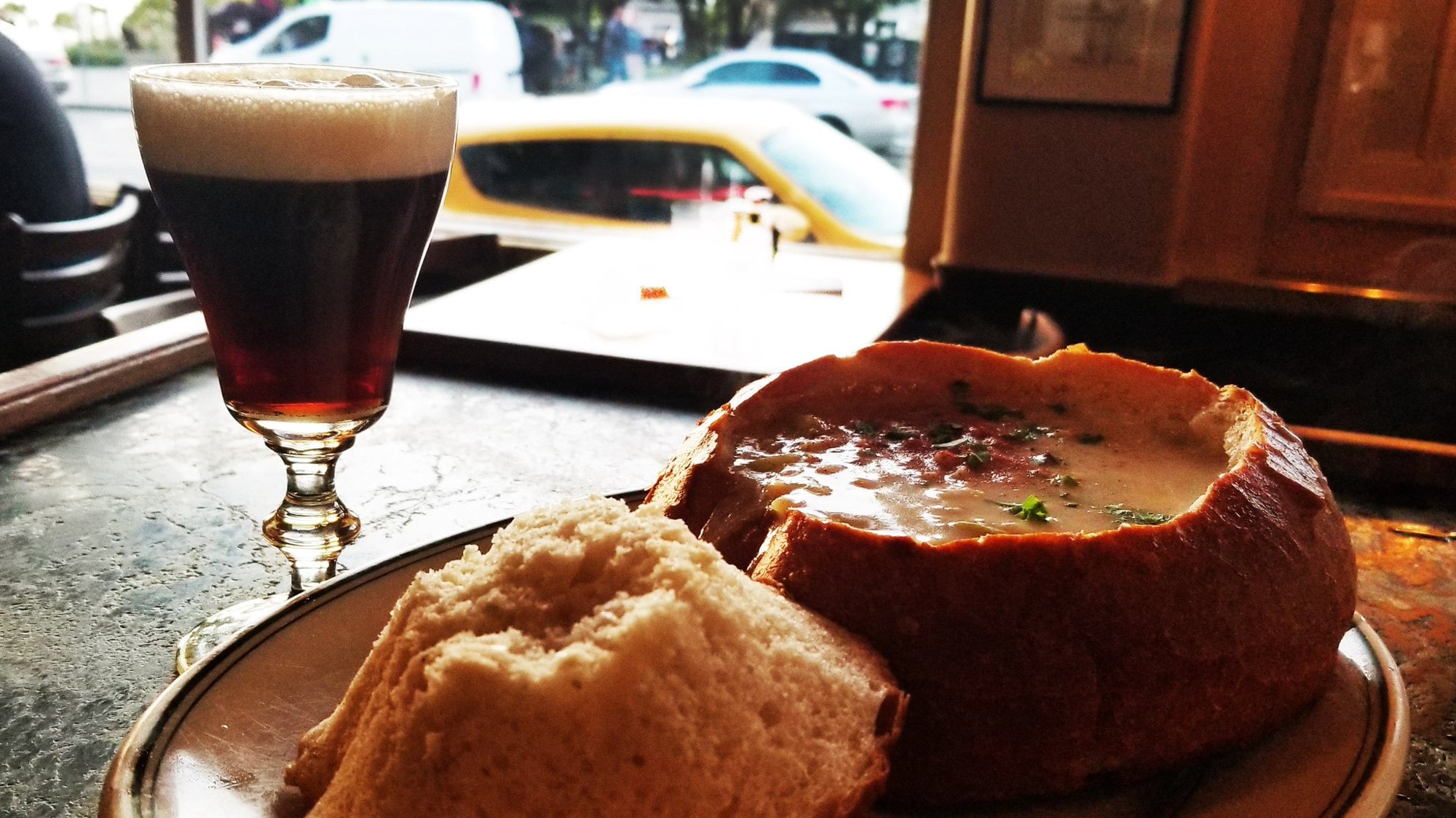 Clam chowder in sourdough bread bowl and original Irish Coffee