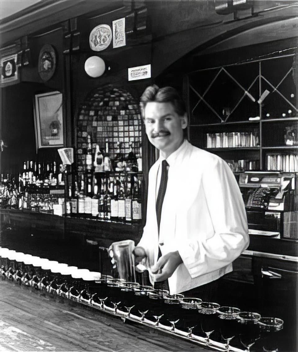 Bartender Larry Nolan pouring Irish Coffee